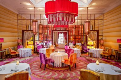 Vibrant reds, pinks and oranges decorating fine dining restaurant Sketch in London