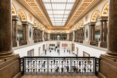 The grand, sun-lit foyer of the Royal Museums of Fine Arts of Belgium in Brussels