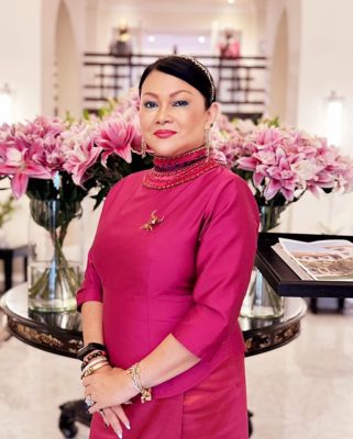 Woman in Pink in a Hotel Lobby