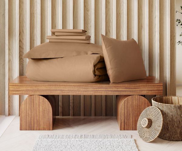 Mövenpick cotton sateen bedding set in caramel brown with folded duvet cover and pillowcases