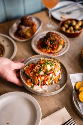 Vibrant plates of Middle Eastern food at a fine dining restaurant