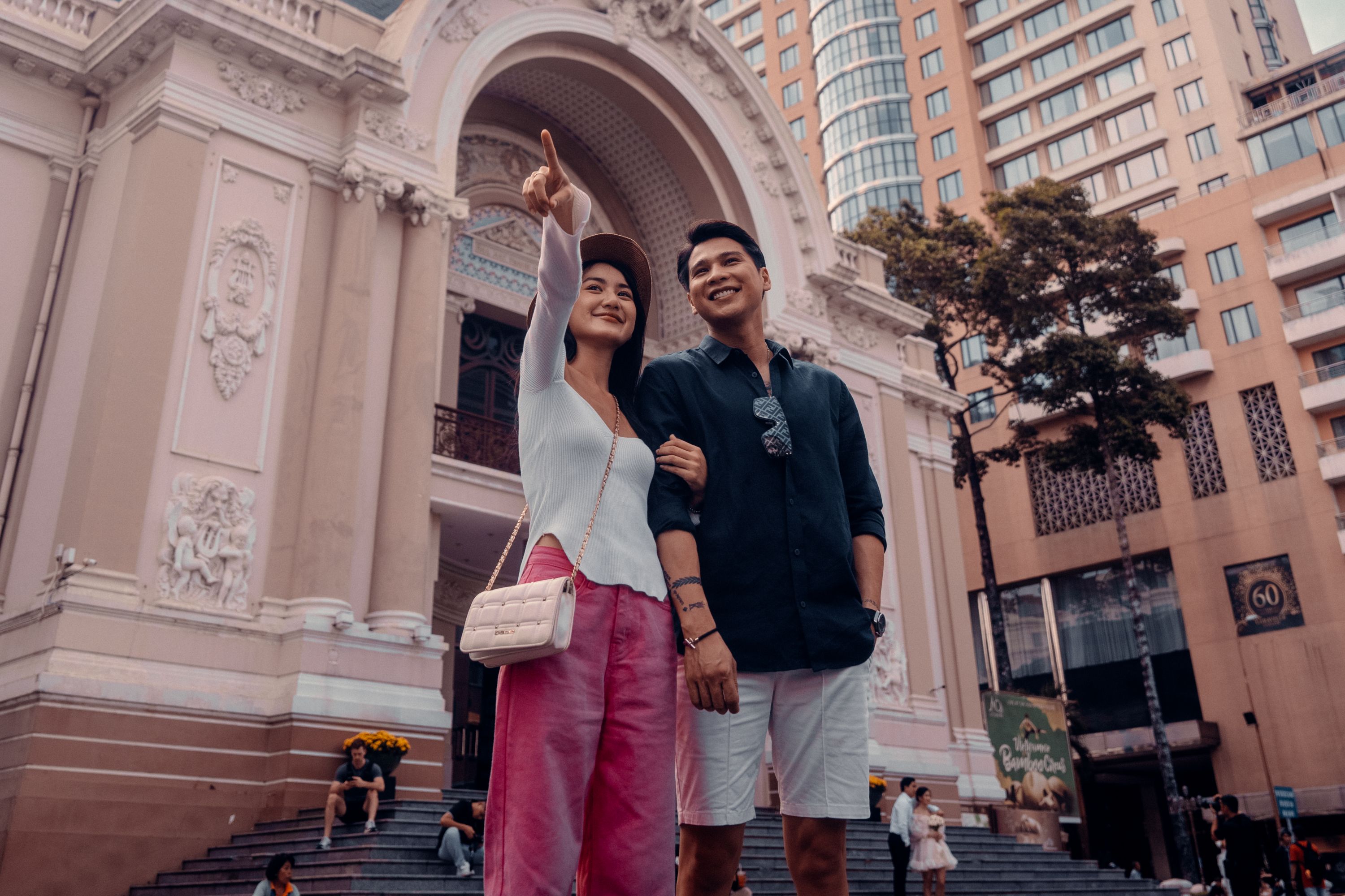 Couple outside Saigon Opera House in Vietnam