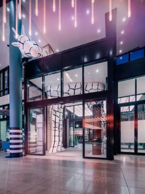 The quirky zebra sculpture peeking into the lobby at Pullman Berlin Schweizerhof