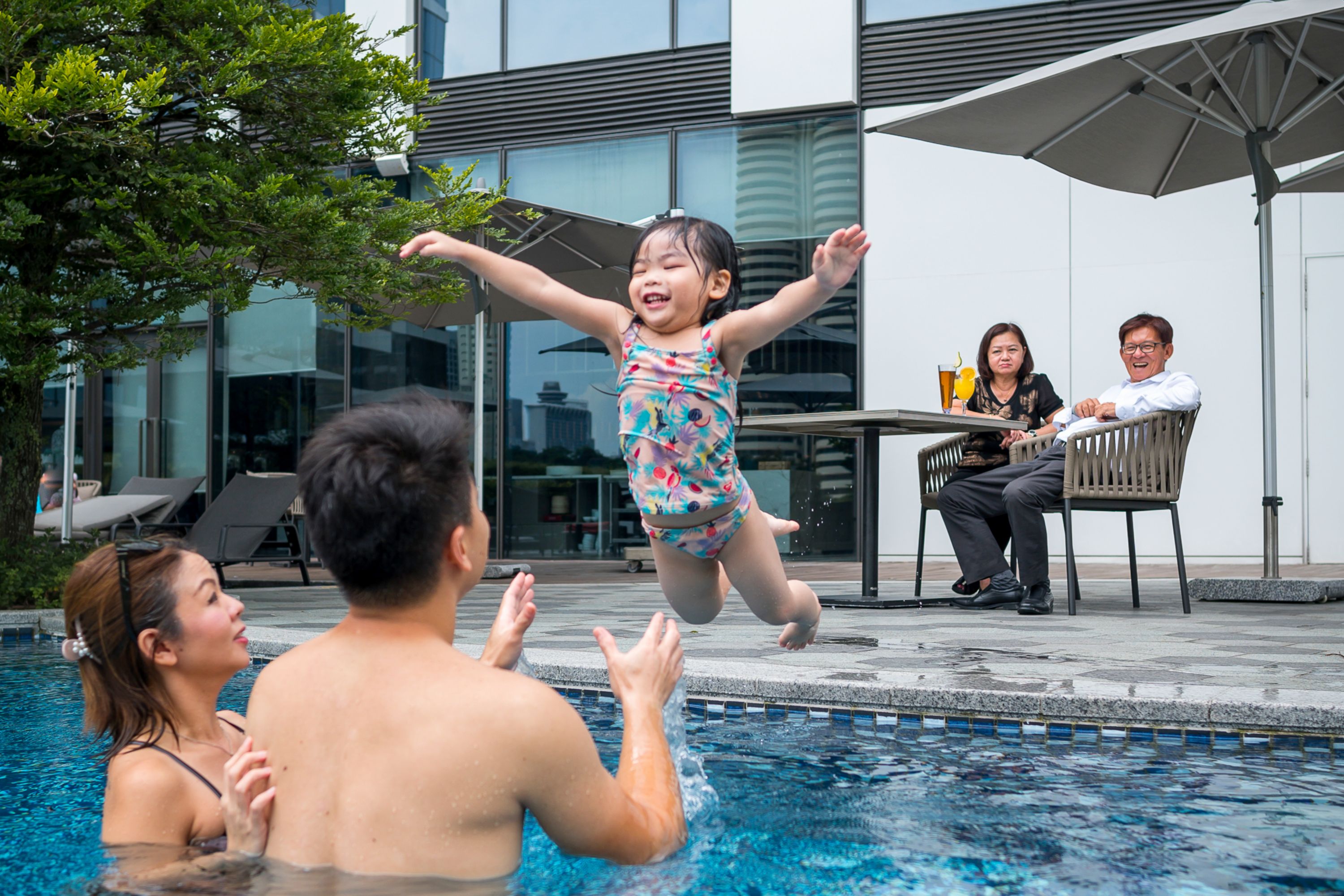Family in the pool at Novotel Singapore on Stevens