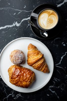A breakfast dish and espresso