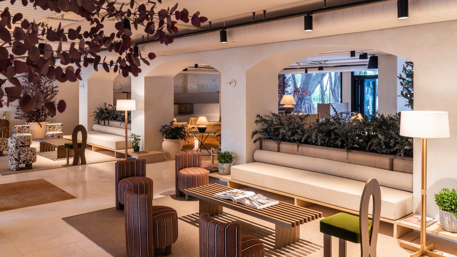 The open-plan lobby at Pullman Riga Old Town, with exposed brick walls and a bar