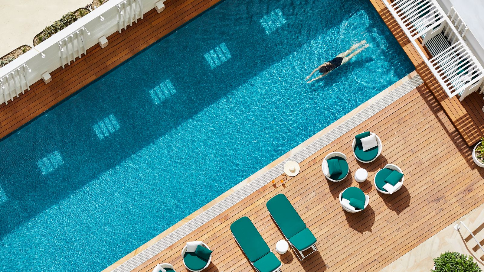 Aerial view of a person swimming in a pool at Sydney hotel