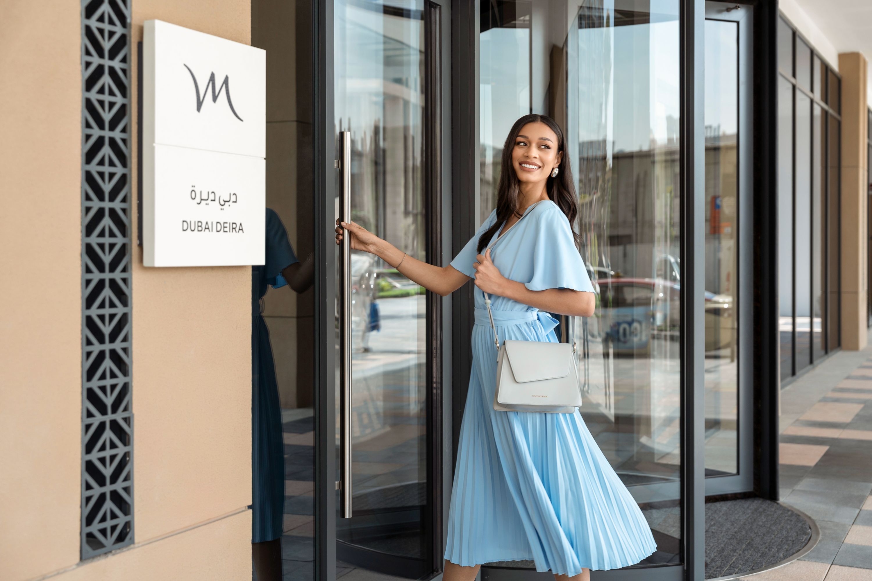 Woman entering Mercure Dubai Deira