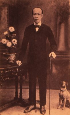 Vintage Portrait: Man with Cane and Dog