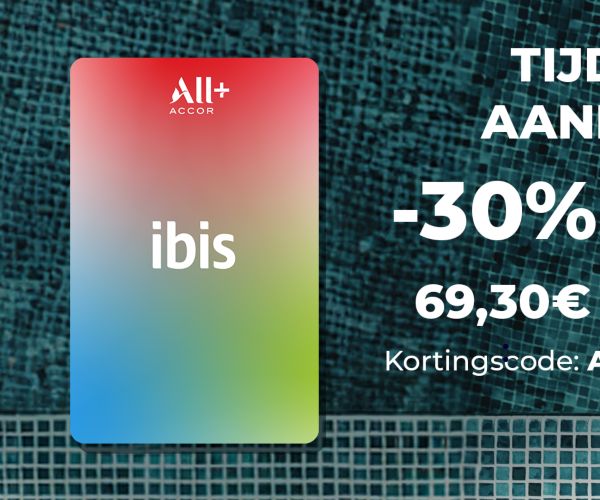 A smiling person with a large afro hairstyle, wearing a denim jacket and yellow headphones around their neck, sits on steps. To the left, there is an Ibis logo on a gradient background with red and green hues. Perfect for leisure or business stays, enjoy 15% OFF your next visit!