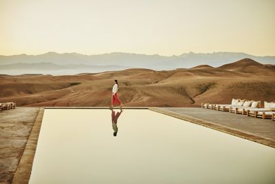 A traveller in a desert landscape having some alone time