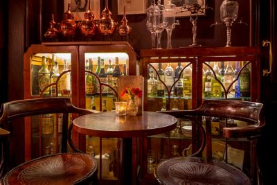 The low-lit, retro-inspired interior of Nightjar cocktail bar in London