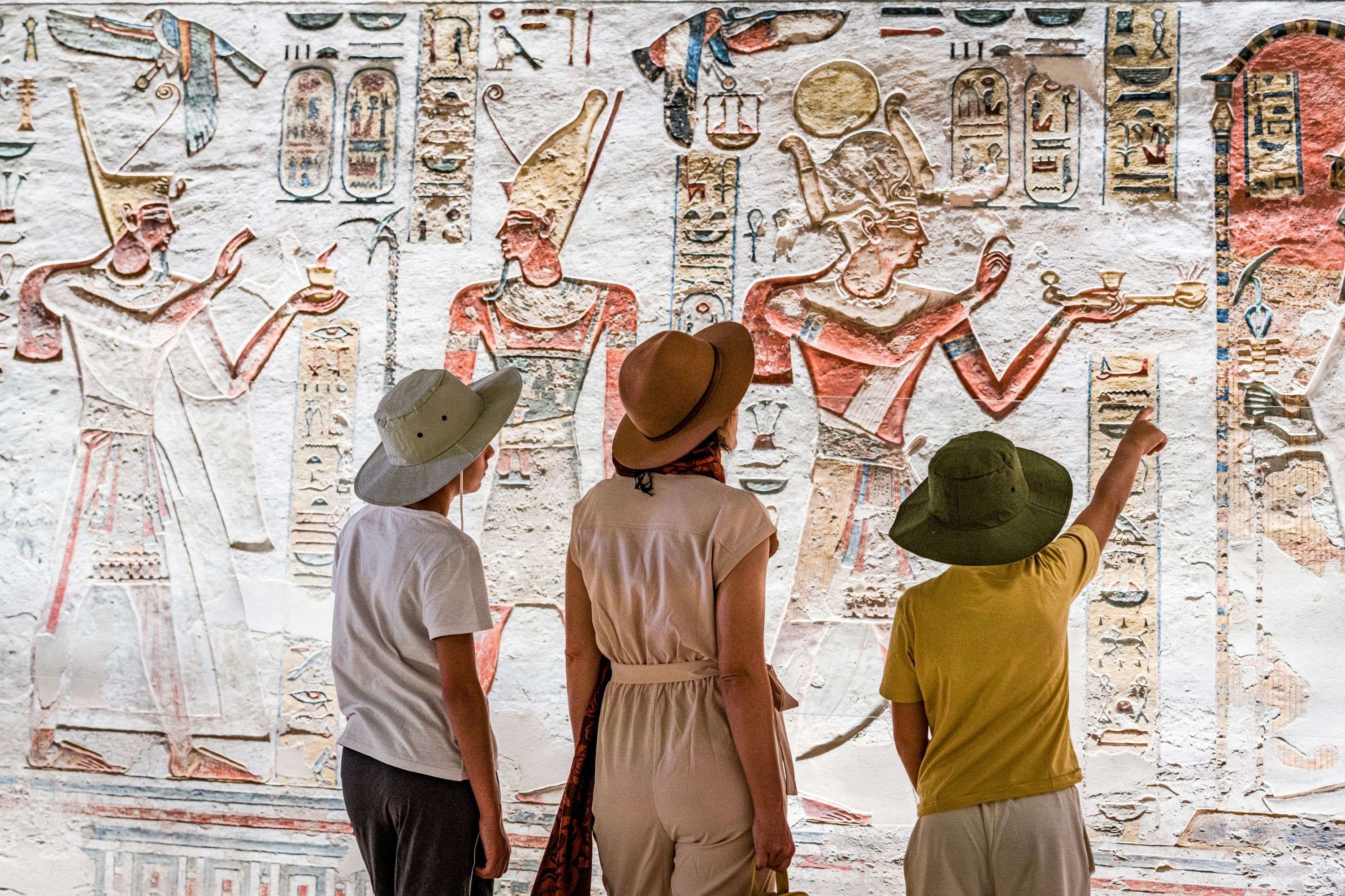  Family admiring art inside Ramses IX Tomb, Luxor
