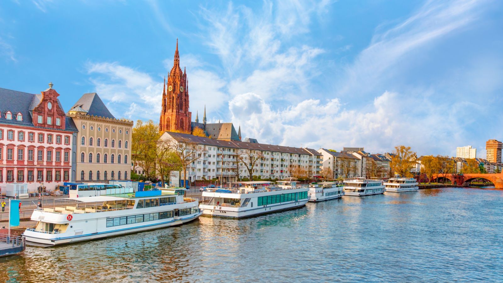 Frankfurt skyline with river and green trees Germany